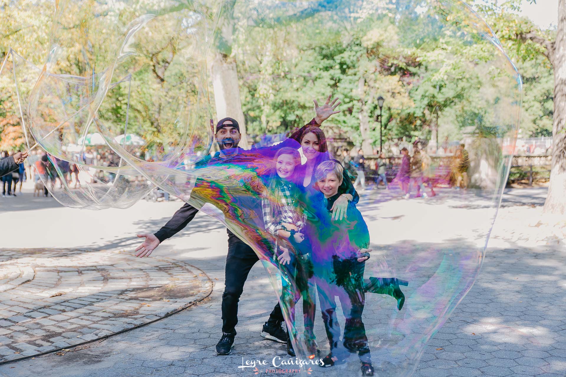 family session in central park with giant bubbles