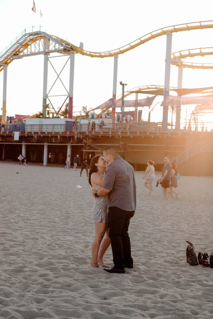 surprise proposal photography at santa monica pier
