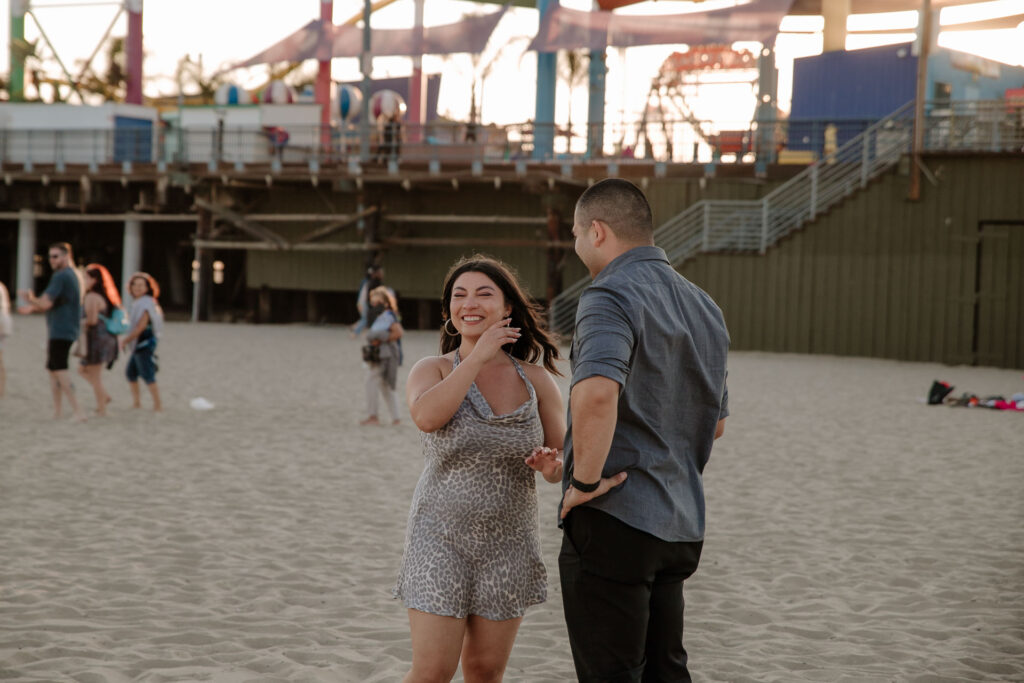 surprise proposal photography at santa monica beach with a professional photographer